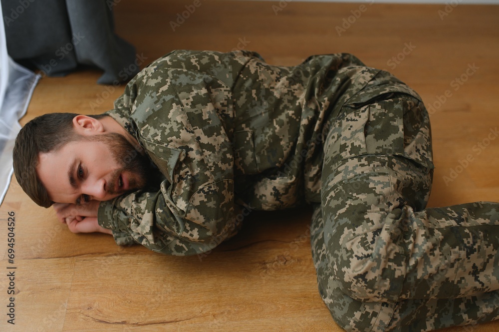 Depressed man recalling war days. Portrait of veteran soldier who has PTSD