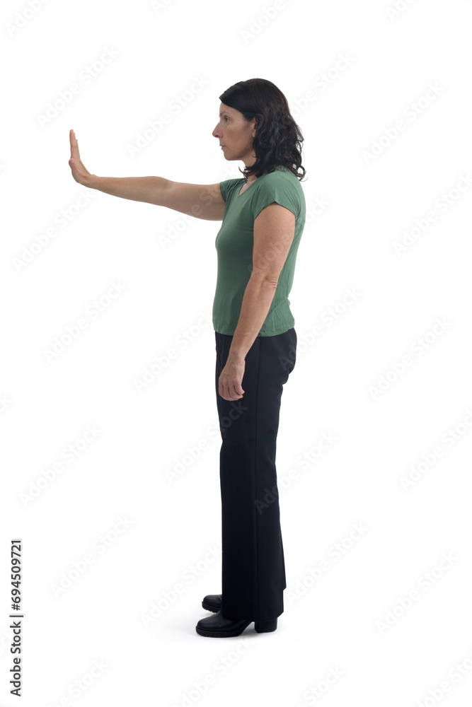 side view of a woman showing the stop sign with their hands on white background side view of a woman showing the stop sign with their hands on white background