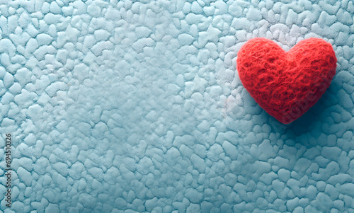 Valentine s day background with red heart on blue textured background