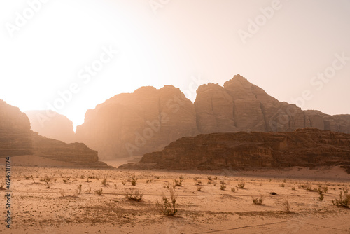 Sunset of sand dune and Amazing Rock in Wadi Rum desert, Jordan. Mars landscape