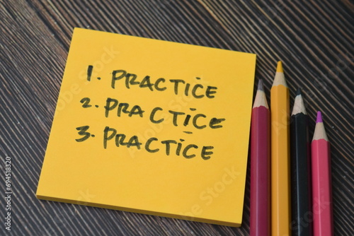 Concept of Pratice, Practice, Practice write on sticky notes isolated on Wooden Table. photo