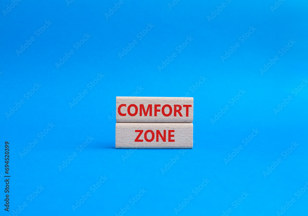 Comfort zone symbol. Concept word Comfort zone on wooden blocks. Beautiful blue background. Business and Comfort zone concept. Copy space Comfort zone symbol. Concept word Comfort zone on wooden blocks. Beautiful blue background. Business and Comfort zone concept. Copy space