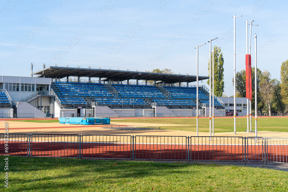 Sports stadium with athletic field and stands