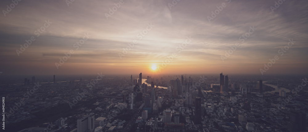 Top view, panorama cityscape of Bangkok, bad weather above city is full of dust that is harmful to respiratory tract, dangerous haze heavy air pollution of fine particulate matter PM2.5 mantle urban.