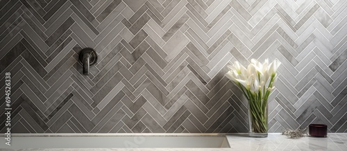Contemporary ensuite bathroom with a marble mosaic herringbone shower wall.