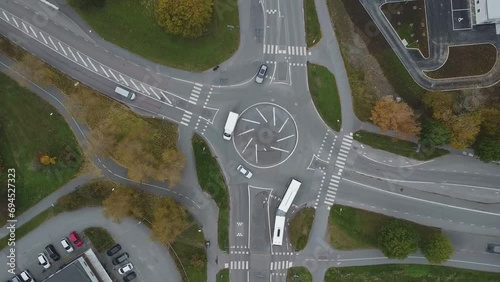 Top down view of a Swedish roundabout with examples of sustainable transportation such as busses and people cycling