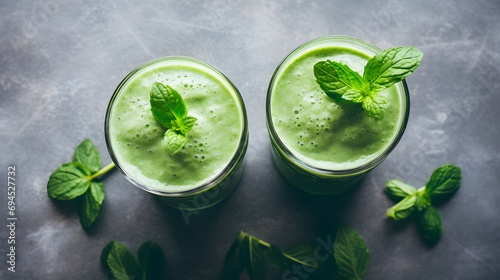 Green Smoothie Garnished with Fresh Mint Leaves in Glasses
