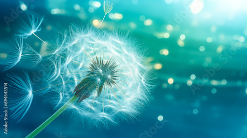 An ethereal dandelion seedling drifts through an aqua world of light  illuminated by sparkling specks. Perfect for creating a serene yet dreamlike atmosphere.