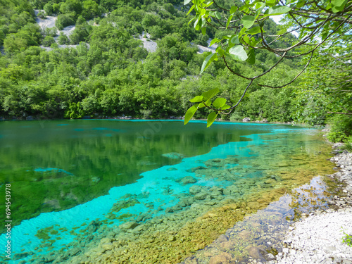 Scenic view of turquoise colored Lake Cornino near Udine in Friuli-Venezia Giulia  Italy  Europe. Peaceful serene scene on Alpe Adria trail in Italian Alps. Calcium sulphate gypsum in water. Awe
