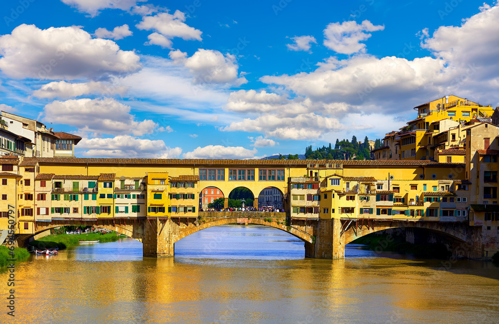 Florence (Firenze, Italy. Panoramic view to ancient bridge Ponte Vecchio at river Arno in florence old town, famous touristic place of Tuscany region, Italy