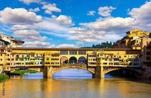 Florence (Firenze, Italy. Panoramic view to ancient bridge Ponte Vecchio at river Arno in florence old town, famous touristic place of Tuscany region, Italy