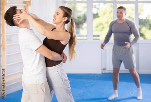 Woman delivers painful blow to eyes of an attacking man - self-defense training for women and men © JackF