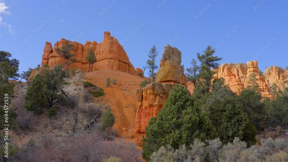 Establishing shot of mountains with red rocks in Red Canyon Arch, Red Canyon National Park, Utah, North America. Day time. ProRes 422 HQ. Establishing shot of mountains with red rocks in Red Canyon Arch, Red Canyon National Park, Utah, North America. Day time. ProRes 422 HQ.