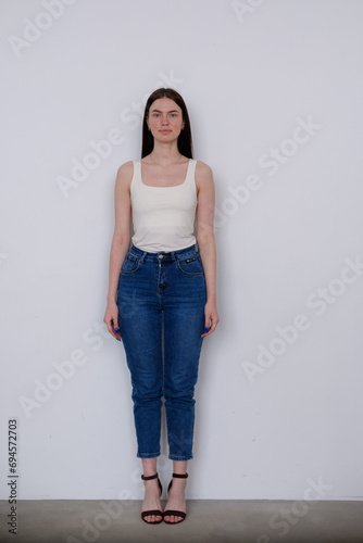 Young girl model snap in white t-shirt front look full length on white background