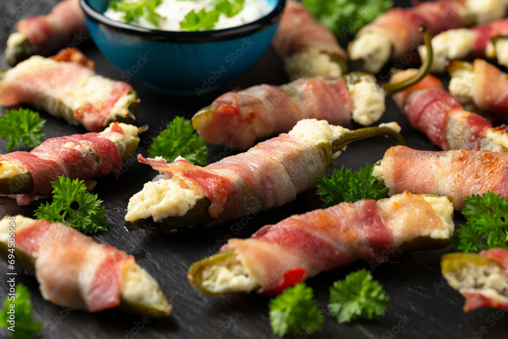 Homemade Bacon Wrapped Jalapeno Poppers with Cream Cheese and herbs. Homemade Bacon Wrapped Jalapeno Poppers with Cream Cheese and herbs.