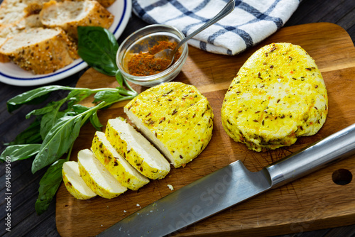 Ready-to-serve Lithuanian cheese in cafe. Keptas varskes suris su ciberzole photo