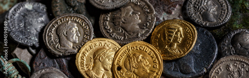 A treasure of Roman gold and silver coins.Trajan Decius. AD 249-251. AV Aureus.Ancient coin of the Roman Empire.Authentic silver denarius, antoninianus,aureus of ancient Rome.Antikvariat. photo