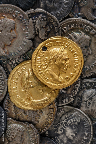 A treasure of Roman gold and silver coins.Trajan Decius. AD 249-251. AV Aureus.Ancient coin of the Roman Empire.Authentic silver denarius, antoninianus,aureus of ancient Rome.Antikvariat. photo