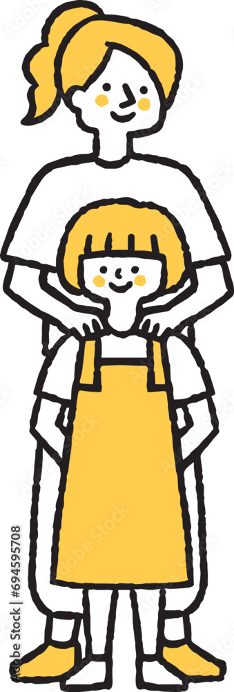 子どもの肩に手を当てている女性 子どもの肩に手を当てている女性