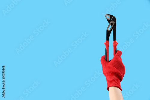 Female hand in red glove ho...