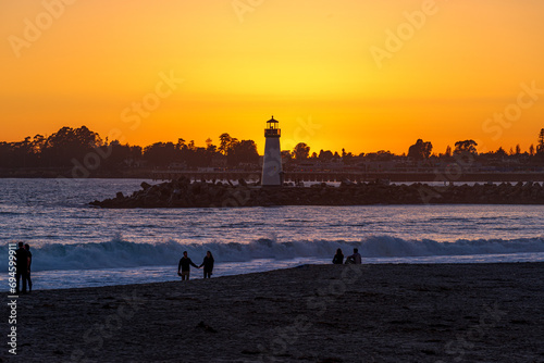 Couples gather around for sunset at Walton Lighthouse in Santa Cruz, CA