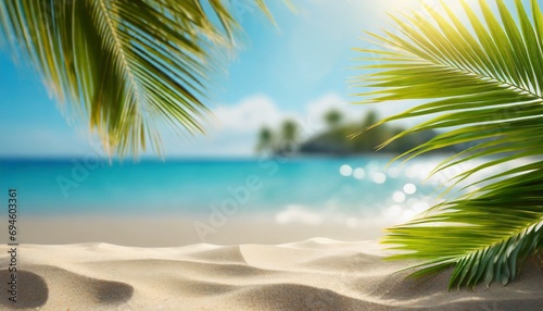 Palm tree on tropical beach with blue sky and white clouds abstract background.   © adobedesigner