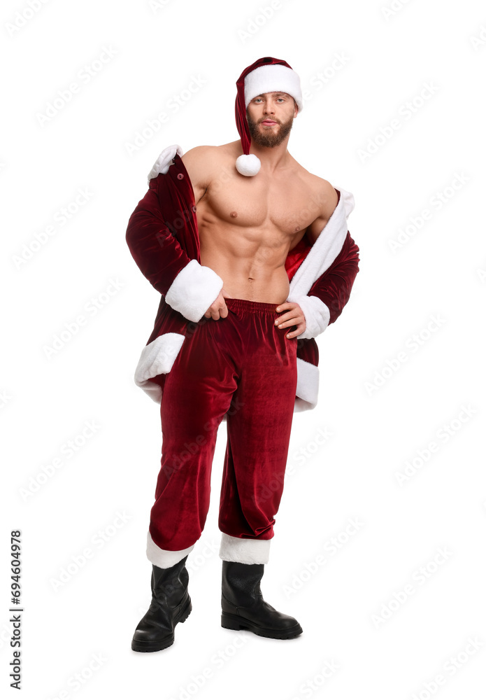 Attractive young man with muscular body in Santa costume on white background Attractive young man with muscular body in Santa costume on white background