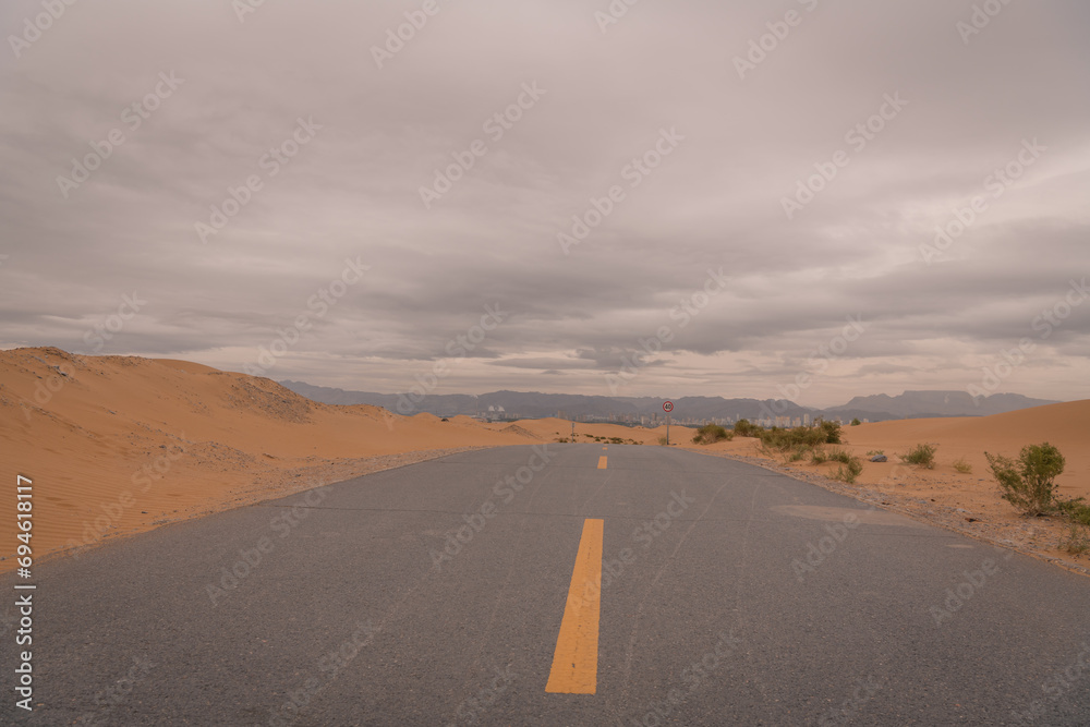 Fototapeta premium An empty highway going through the desert, Inner Mongolia, China