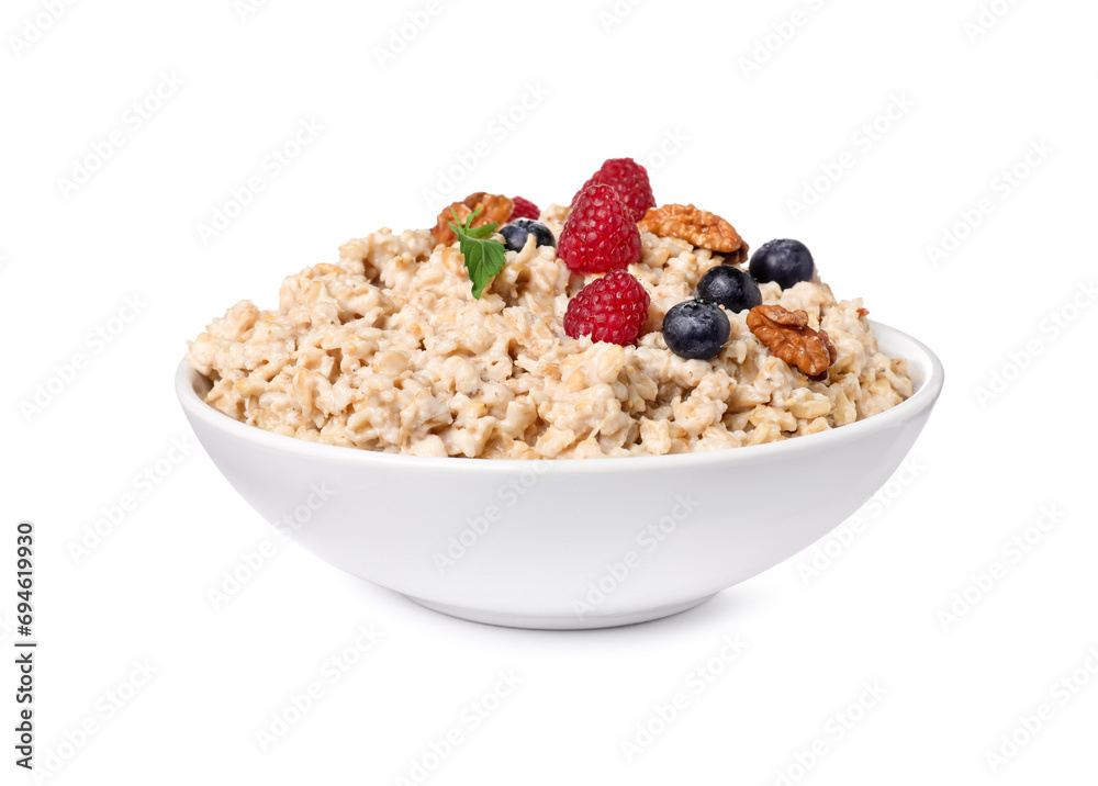 Tasty boiled oatmeal with berries and walnuts in bowl isolated on white Tasty boiled oatmeal with berries and walnuts in bowl isolated on white