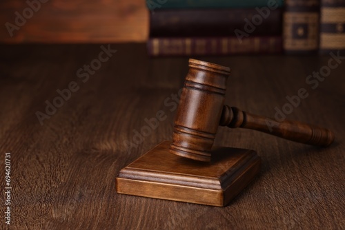Law concept. Judge's gavel on wooden table, space for text