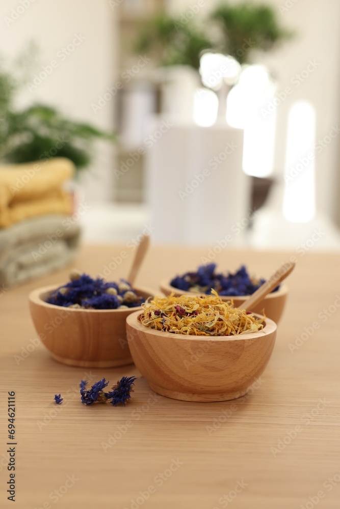 Dry flowers on wooden table indoors, space for text. Spa time Dry flowers on wooden table indoors, space for text. Spa time
