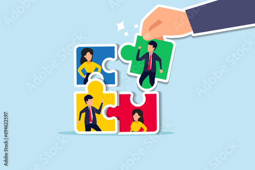 New joiner to fill in team and solve problem, teamwork to get solution, put right man in the right job to fit job description concept, businessman hand HR put new joiner to connect jigsaw puzzle.