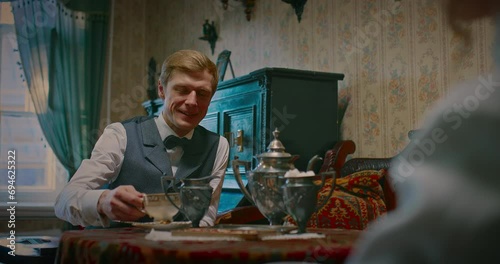 happy spouses drinking tea in old house in 19th century, portrait of man, history, 4K, Prores