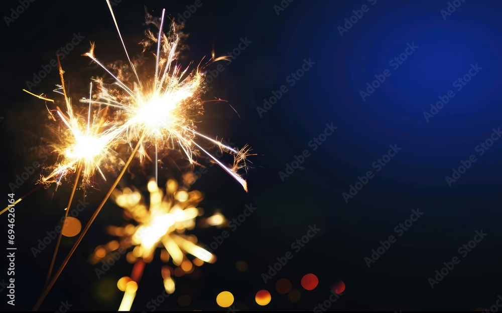 nighttime burning fireworks and blur lights,new year's day,background for banner greeting card