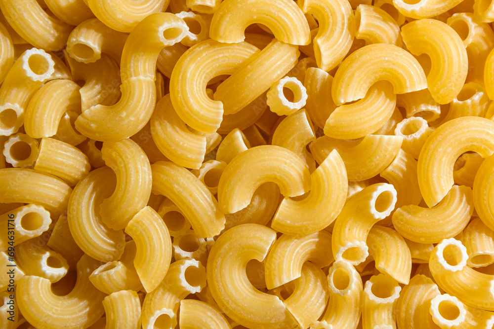 Uncooked Chifferi Rigati Pasta: A Culinary Canvas of Chifferi Rigati, Creating a Lively and Textured Background for Gourmet Cooking. Dry Pasta. Raw Macaroni - Top View, Flat Lay Uncooked Chifferi Rigati Pasta: A Culinary Canvas of Chifferi Rigati, Creating a Lively and Textured Background for Gourmet Cooking. Dry Pasta. Raw Macaroni - Top View, Flat Lay