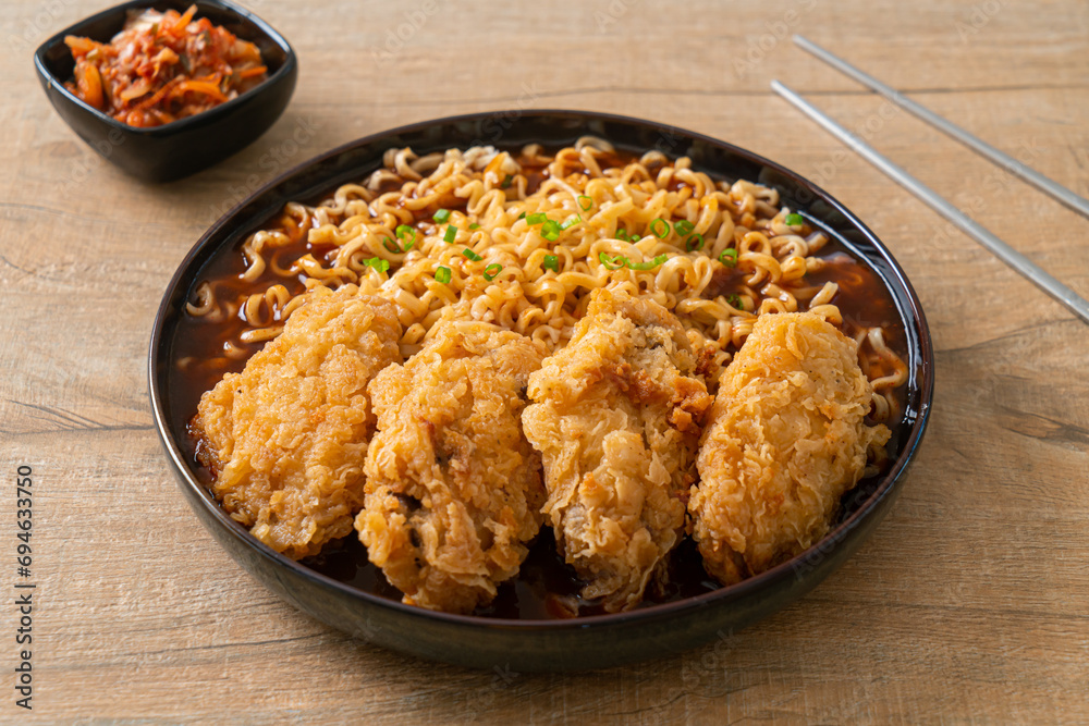 Korean instant noodles with fried chicken or Fried chicken ramyeon Korean instant noodles with fried chicken or Fried chicken ramyeon