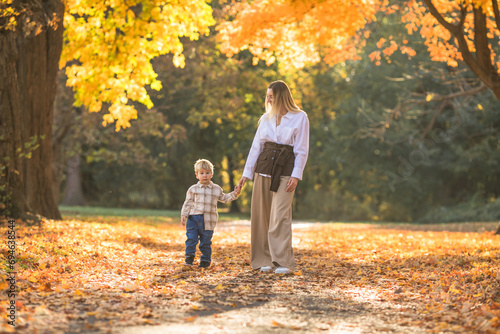 Mothers day, love family. Family on autumn walk in nature outdoors. Mother and child with hugging tenderness