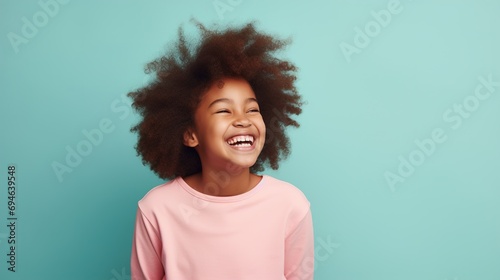Laughing Black Girl isolated on Minimalist Background. DEIB, Diversity, Equity, Inclusion, Belonging
 photo