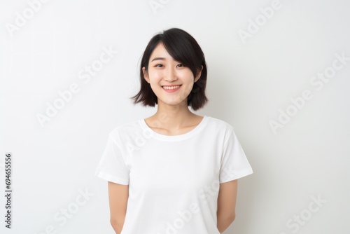 Young Asian woman smiling portrait white background