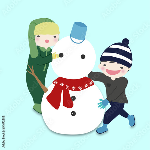 雪だるまを作って遊ぶ子供