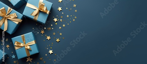 Blue gift box with gold ribbon © Doni_Art