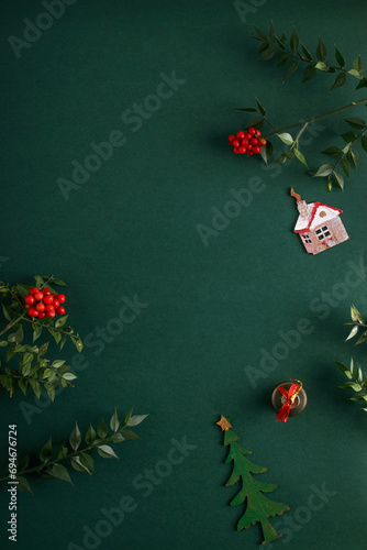 Christmas flowers and decorations on an isolated green background