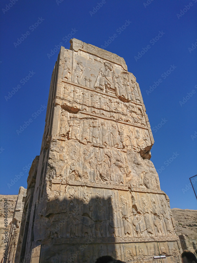 Hieroglyphs carved on the wall of an ancient temple. Remains of Persepolis. Achaemenid period. Antiquities before Christ