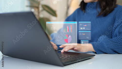 Woman using computer with big data graph Statistical analysis. Program developer, software, apps, corporate business innovation.