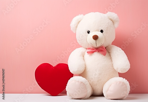 Teddy bear holding a heart-shaped pillow with plank © oneli