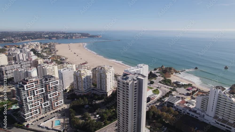 Drone establisher beach Praia da Rocha in Portimao Portugal, behind skyscrapers Drone establisher beach Praia da Rocha in Portimao Portugal, behind skyscrapers