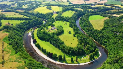 Aerial Pullback Shot of The River Tweed in Scottish Borders Near Melrose, Scotland photo