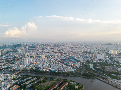 Panoramic view of Saigon  Vietnam from above at Ho Chi Minh City s central business district. Cityscape and many buildings  local houses  bridges  rivers