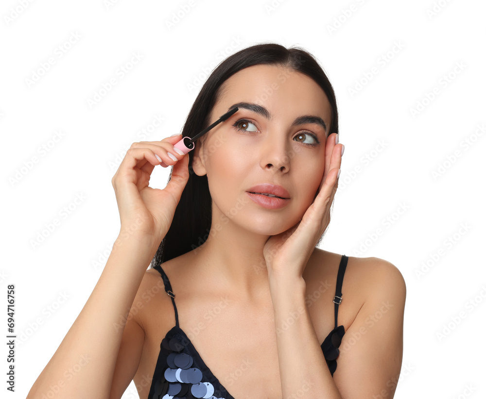Beautiful young woman applying mascara on white background Beautiful young woman applying mascara on white background