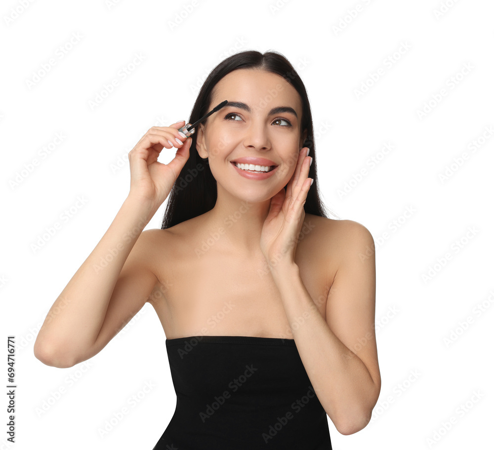 Beautiful young woman applying mascara on white background Beautiful young woman applying mascara on white background